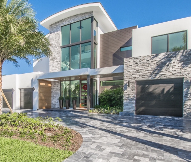 Luxury home entrance with floor-to-ceiling impact windows